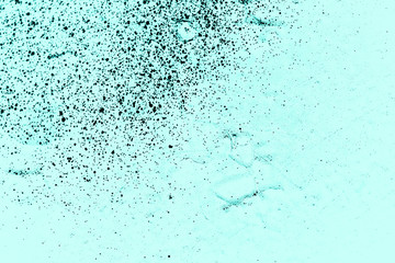 Vintage azure background. Rough painted wall of turquoise color. Imperfect plane of cyan colored. Uneven old decorative toned backdrop of aqzure tint. Texture of teal hue. Ornamental stony surface.