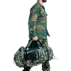 Man in military uniform, camouflage with backpack goes walking on white background isolation