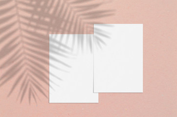 Blank white vertical paper sheet 5x7 inches with palm shadow overlay. Modern and stylish greeting...
