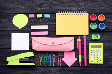 School supplies on black wooden table