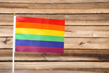 Rainbow flag on brown wooden table