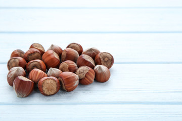 Ripe hazelnuts on wooden table