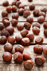 Ripe hazelnuts on brown wooden table