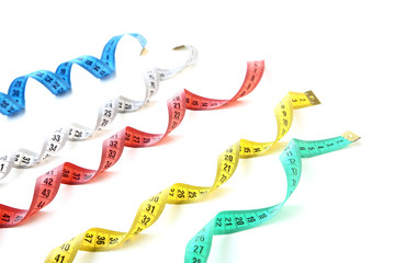 Colorful measuring tapes isolated on white background