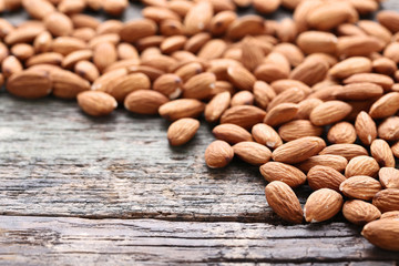 Almonds on grey wooden table