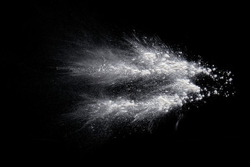 Color powder white splashes  dust on a black background.
