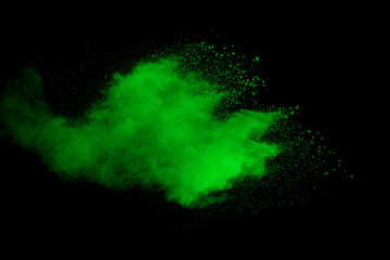 Explosion of green dust on black background. - 276365096