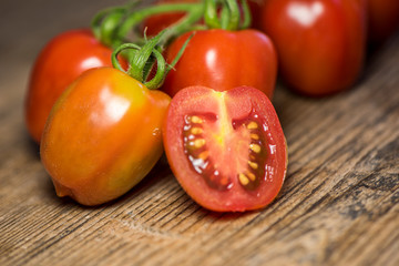 Fresh tomatoes on wood background