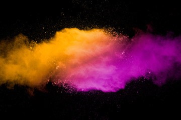 Explosion of multicolored dust on black background. - 276365225