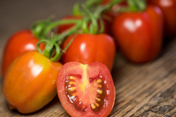 Fresh tomatoes on wood background