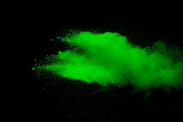 Explosion of green dust on black background. - 276365237