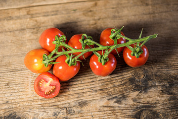 Fresh tomatoes on wood background