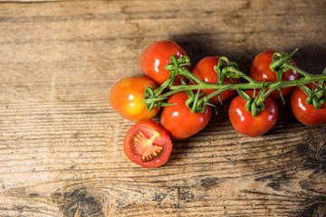 Fresh tomatoes on wood background
