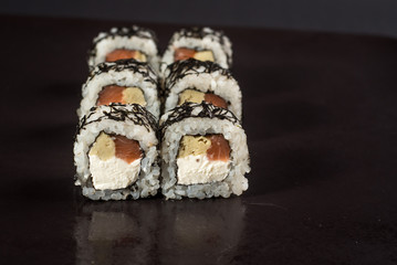 White japanese sushi on black background