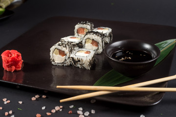 White japanese sushi on black background