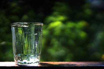 clear water in a glass in nature