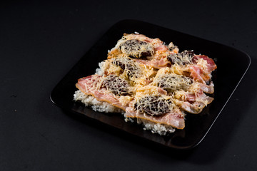 Sushi pizza on black