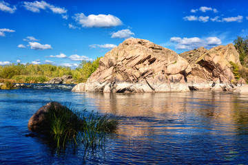 Amazing nature daytime landscape, scenic rocky canyon with river, rocks and blue sky with clouds, National park Bugski Guard, Mykolaiv region, Ukraine. Outdoor travel background