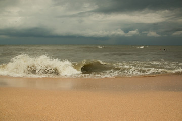 Storm waves on the sandy shore of the Azov sea