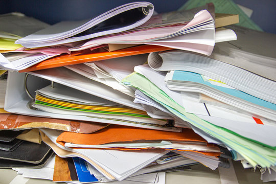 Messy file document and Office Supplies in filing cabinets at work office