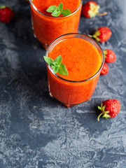 Strawberry smoothie in glasses with copyspace for text