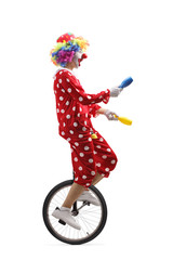 Juggler clown riding a unicycle and juggling © Ljupco Smokovski