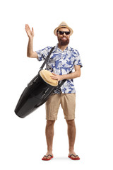 Male tourist playing conga drums