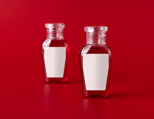 Shampoo and shower gel with blank label on red background for print design and mock up