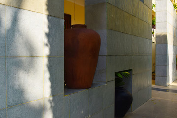 old big vase. Large jug. Design and interior of the hotel. The wall of the hotel.