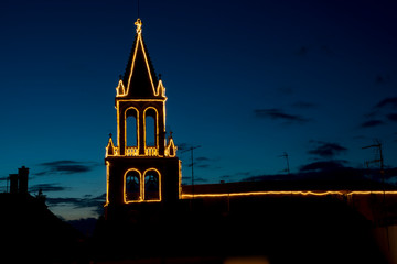 palamos illuminated church in the night