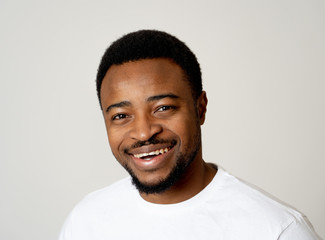 Fototapeta premium Close up portrait of smiling and laughing attractive man in happy face human emotion and expression