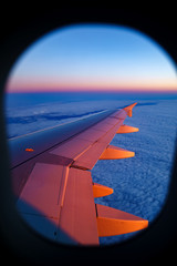 Aerial view from airplane window at sunset
