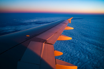 Aerial view from airplane window at sunset