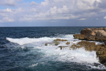 waves crashing on rocks