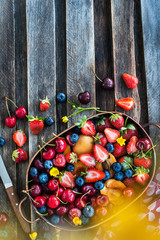 Fresh ripe summer berries and fruits (cherry, strawberry, blueberry, apricots)