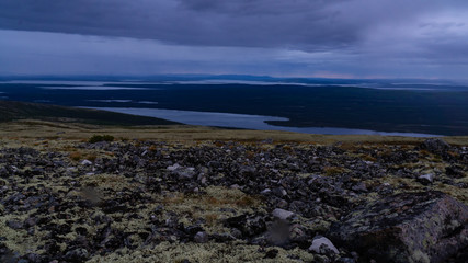 Fototapeta premium Rays of the setting sun over the mountain valley Khibiny