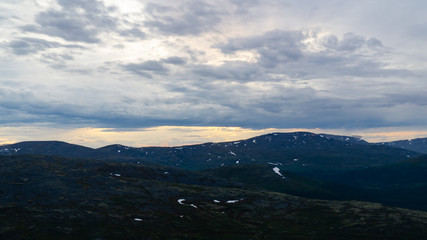 Rays of the setting sun over the mountain valley Khibiny