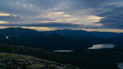 Rays of the setting sun over the mountain valley Khibiny