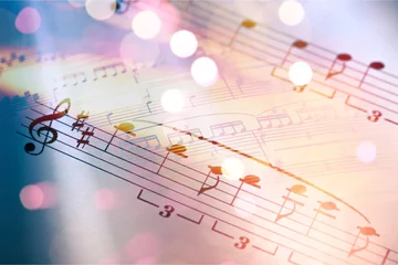 Foto op Plexiglas Sheets with music notes and abstract light bokeh © BillionPhotos.com