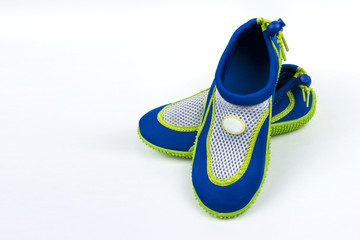 A pair of children's shoes for with an anti-slip sole for swimming in the pool. Isolate on white background