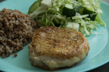 Medallion of pork stewed, buckwheat, cabbage salad, salted cheese and cucumbers