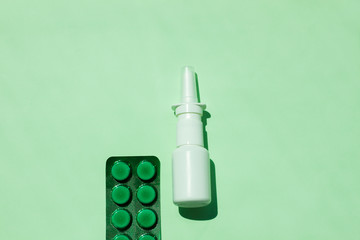White medical nasal spray bottle,a remedy against allergies and runny nose, colds, viral diseases.