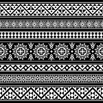 Ikat Aztec ethnic design in black background. Seamless pattern ethnic tile vector illustration. 