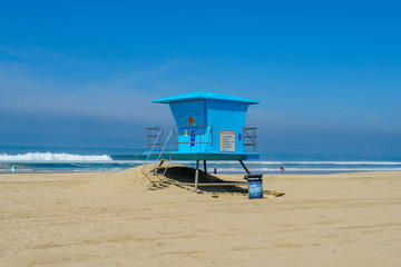 Lifeguard tower on the Huntington Beach during sunny day. Southeast Los Angeles, California, USA.