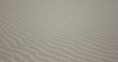 Fototapeta na wymiar beautiful sand with blue sky
