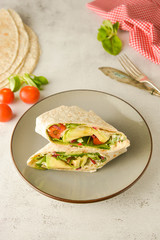 Wraps or torttila. Avocado, vegan wrap sandwiches. Healthy food.