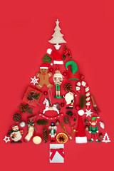 Abstract Christmas tree decoration with winter flora, baubles, ornaments and symbols on red...