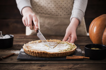 woman cooks pumpkin pie