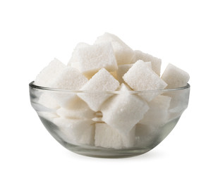 Cubes of refined sugar in a glass plate on a white background. Isolated.