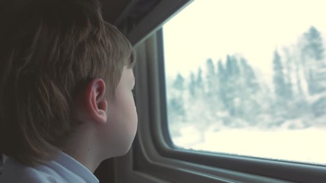 Travel by train in winter. Face close-up, side view.